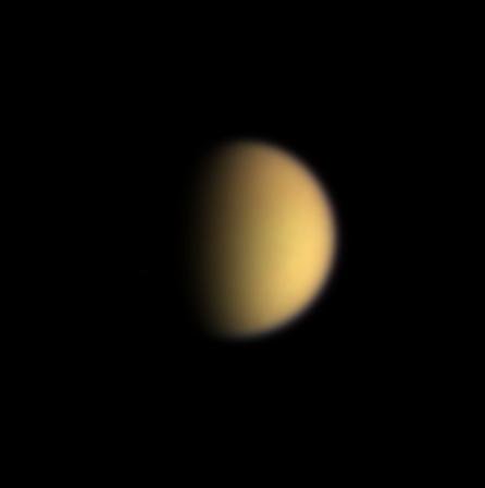 Titan in natural colour from Cassini. The tracker’s marker is enlarged for readability.