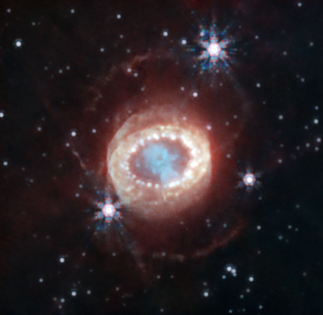 SN 1987A in near-infrared light with rings and ejecta